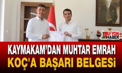 Kaymakamı'ndan Muhtar Emrah Koç'a Başarı Belgesi