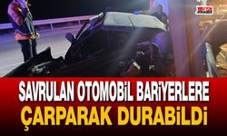 Savrulan otomobil bariyerlere çarparak durabildi