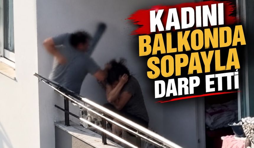 Kadını balkonda sopayla darp etti